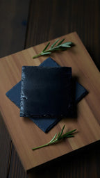 Plain slate coasters with padded feet